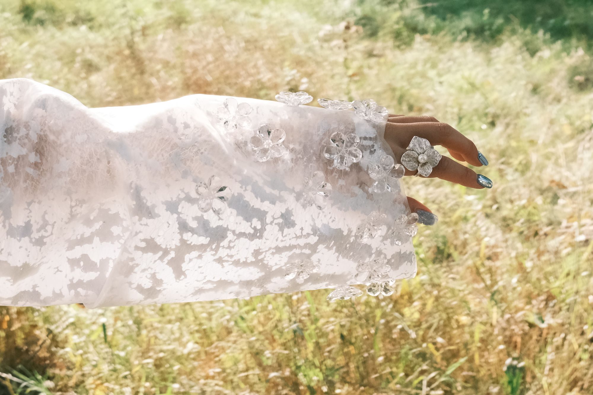 Close-up of a translucent white sleeve with clear flower details